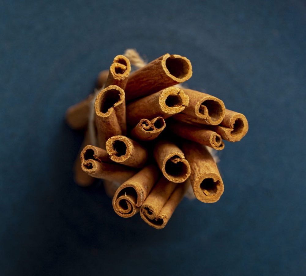 bunch-cinnamon-sticks-dark-blue-background