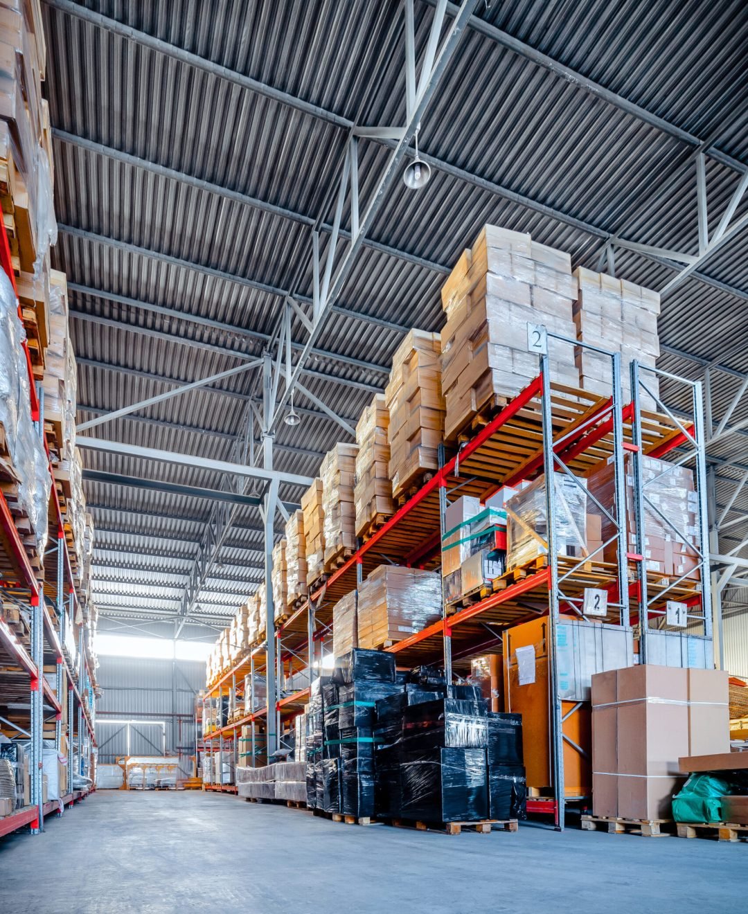 Warehouse industrial and logistics companies. Long shelves with a variety of boxes and containers. Toning the image.